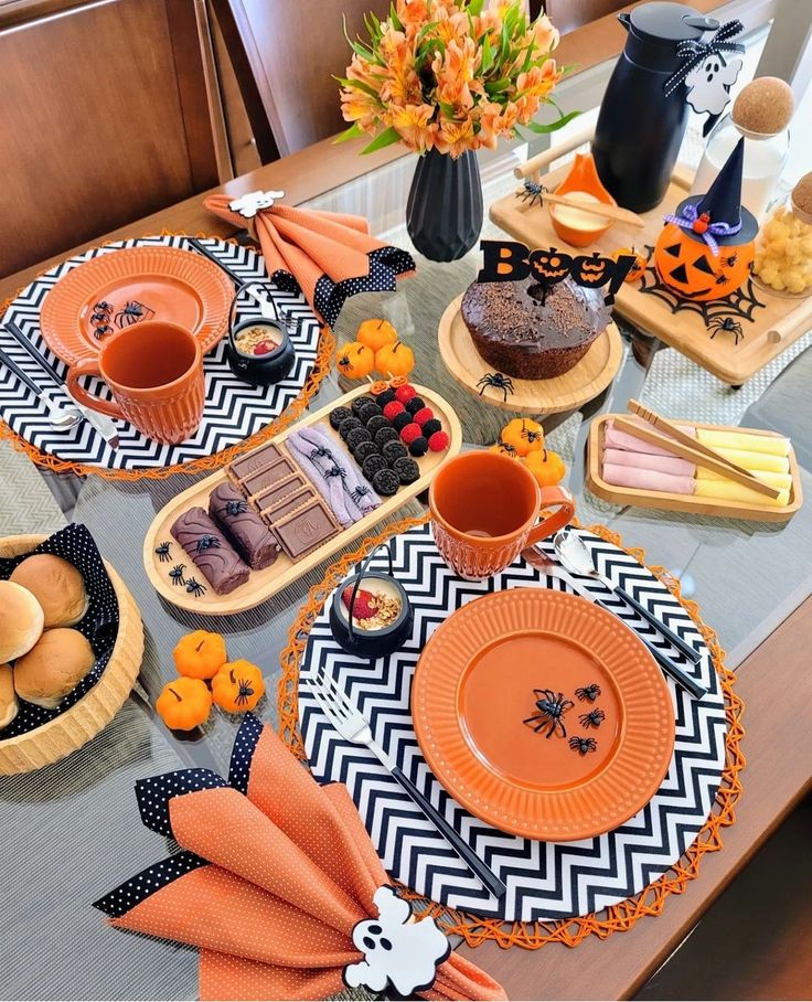 Mesa posta em preto e laranja para o halloween
