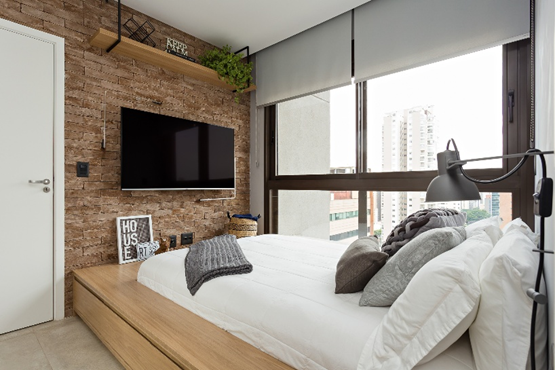 Quarto com revestimento texturizado em formato de tijolinhos