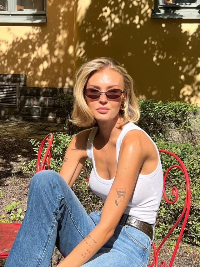 Mulher de pele clara, magra e com cabelo loiro short bob