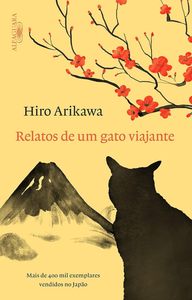 Capa de livro amarela com um gato preto olhando para o Monte Fuji