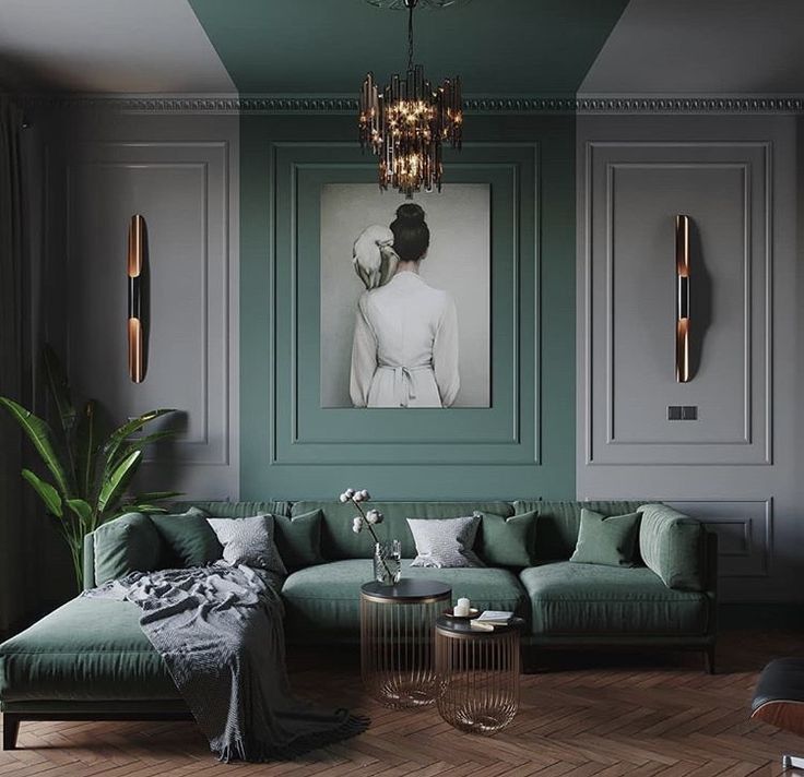 Sala com sofá em veludo verde e boiserie verde e cinza