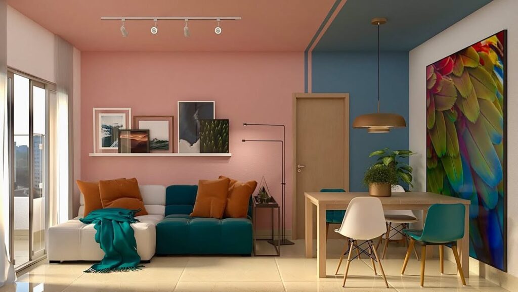 Sala de estar com sofá verde e branco com parede rosa junto à sala de jentar com parede azul