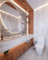 Lavabo pequeno com marcenaria, pedra natural e paredes com revestimento