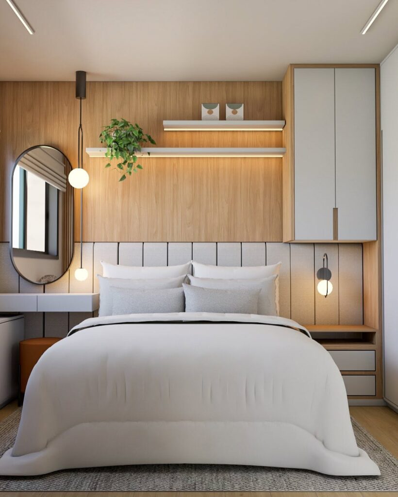 Quarto de casal com cabeceira modular, armário e prateleiras suspensas, arandelas e espelho oval
