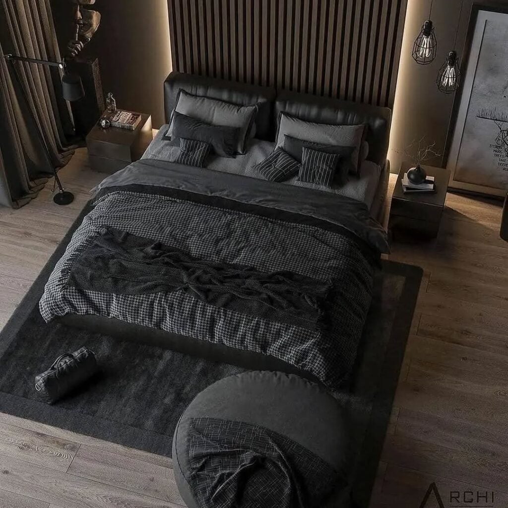 Quarto preto com cama, almofadas e edredom em tons escuros