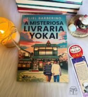 Foto com livro, vela e marca página