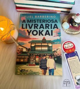 Foto com livro, vela e marca página