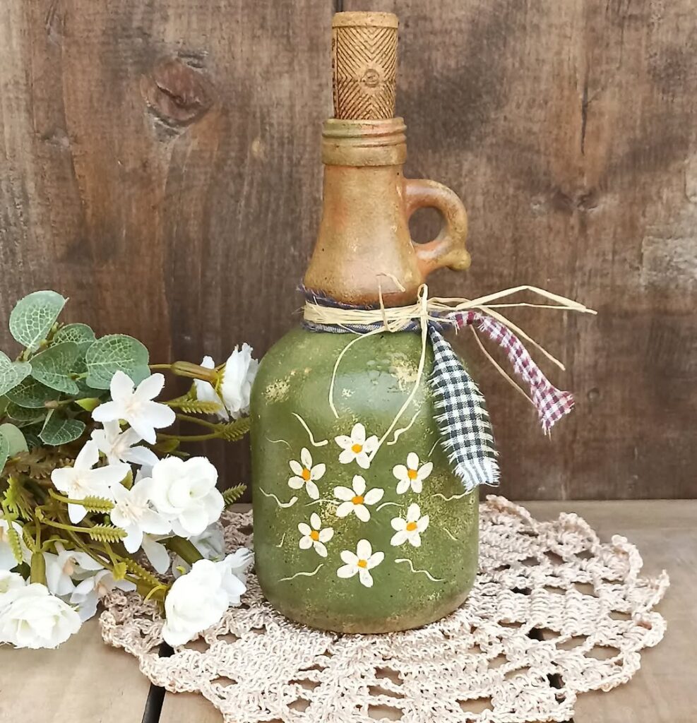 Garrada pintada de verde com flores brancas