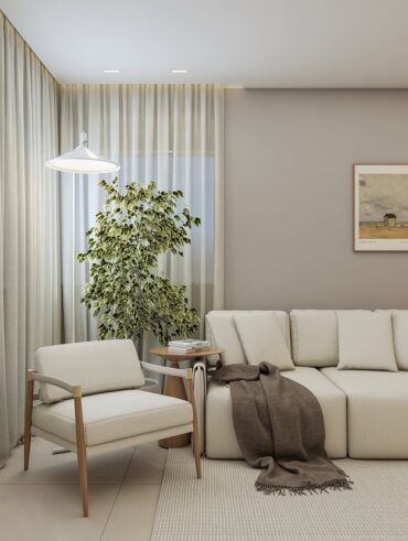 Sala com poltrona de madeira e assento estofado claro ao lado de sofá