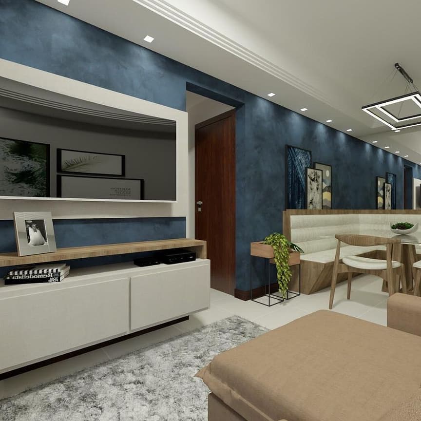 Sala de estar com estante branca e parede em cimento queimado azul
