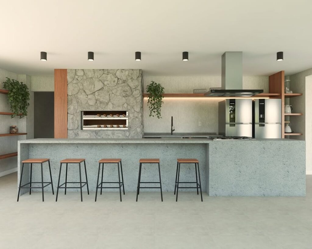 Área gourmet com pedras e bancada em concreto com banquetas