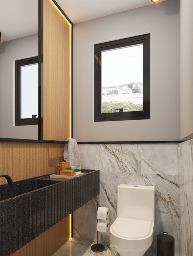 Lavabo com revestimento marmorizado e bancada cinza-escuro