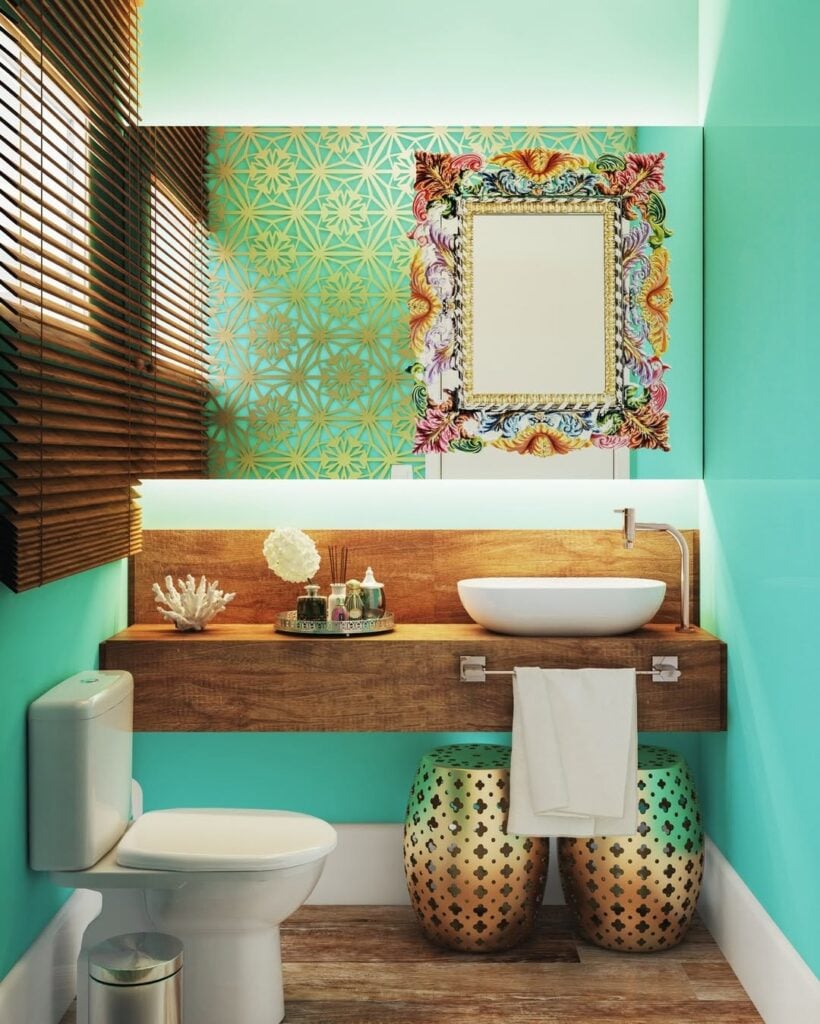 Lavabo com parede verde, bancada de madeira com cuba branca