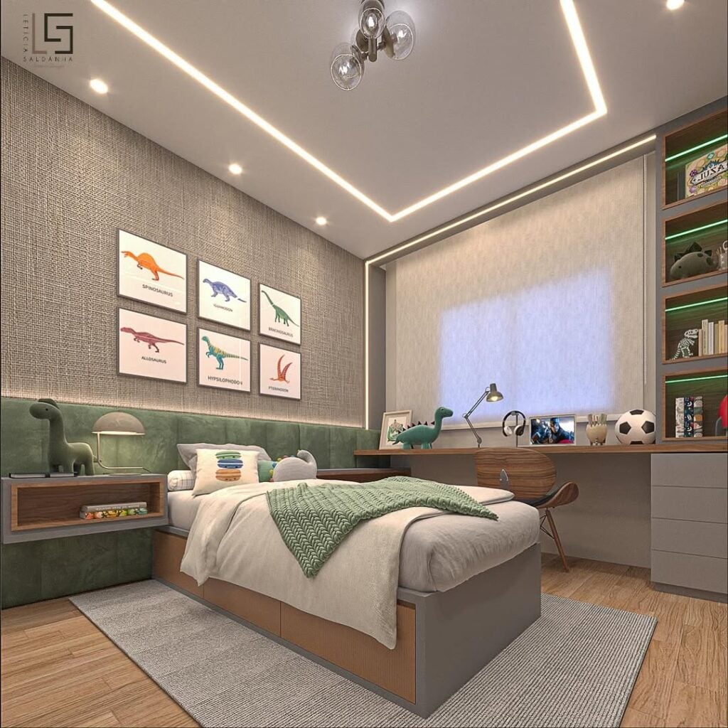 Quarto para menino com paredes cinza e detalhes decorativos verde, com quadros de dinossauros acima da cabeceira