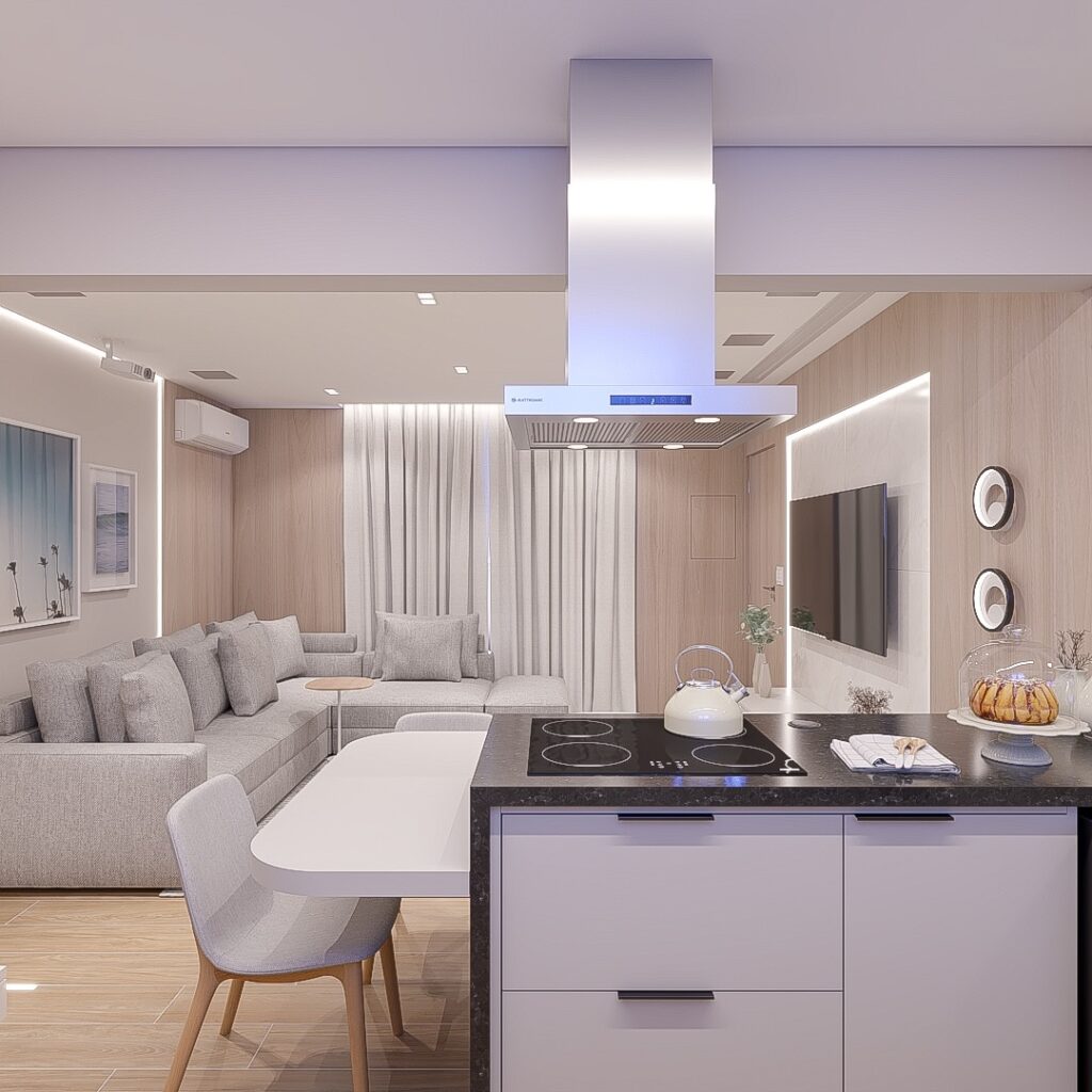 Sala e cozinha integradas em tons claros com fogão cooktop e coifa