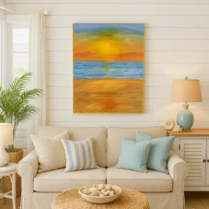 Sala de estar com sofá bege, almofadas em azul-claro, quadro com paisagem de praia na parede