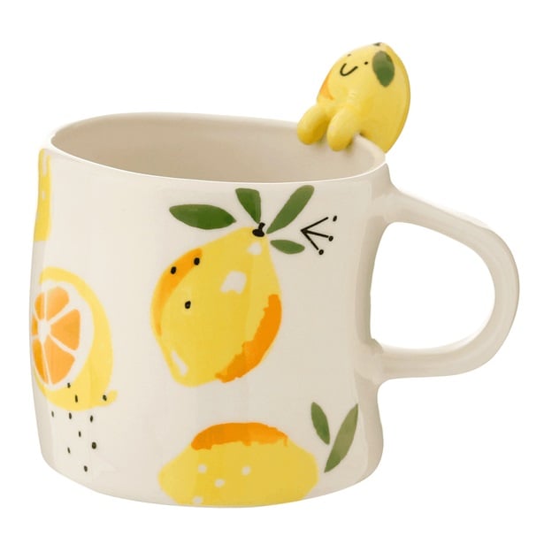 Caneca branca com limões-sicilianos