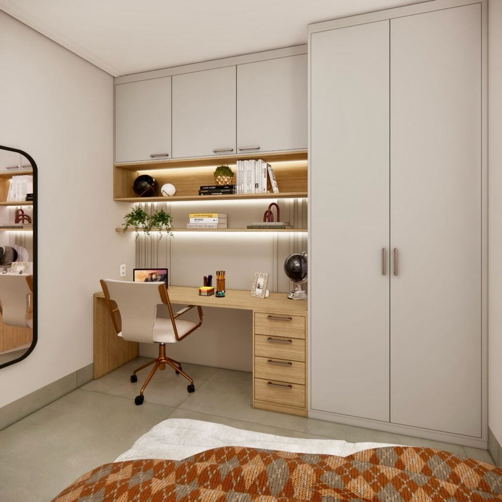 Quarto com escritório ao lado do guarda-roupa, bancada de MDF claro com gavetas e prateleiras com objetos