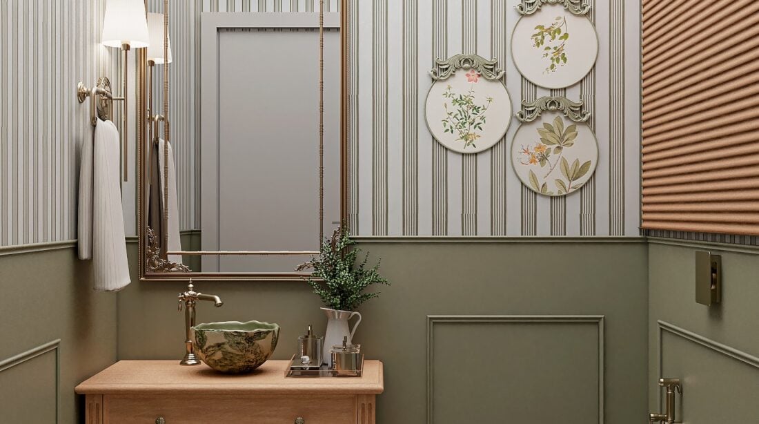 Lavabo pequeno com meia parede verde com boiserie, papel de parede listrado, bancada de madeira com gavetas e cuba de apoio