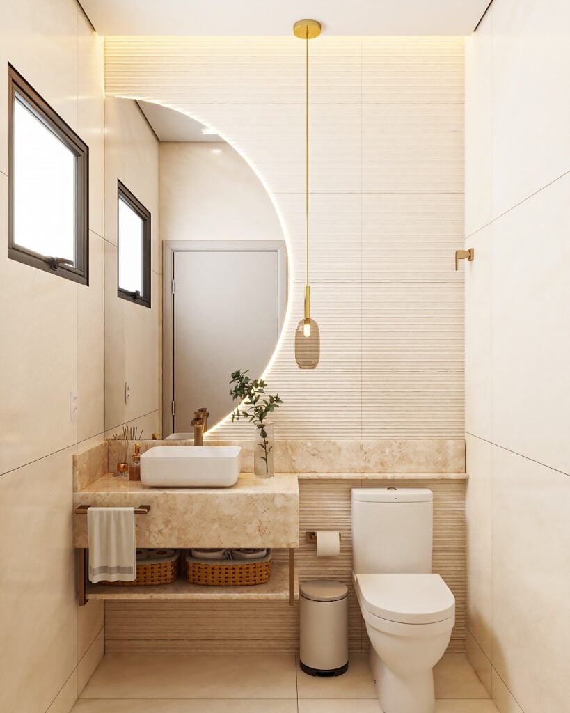 Lavabo pequeno neutro e elegante, louças brancas, pendente e meio espelho circular